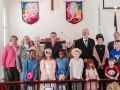Officials and children posed for the 200th Sunday picture