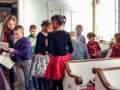 Children gather in the corner to organize