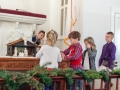 Stella and Parker placing itmes on the altar table