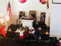 Stella and Camryn placing itmes on the altar table