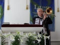 Pastor Kelvin plays trombone