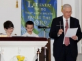 Pastor Kelvin with two confirmands during cross liturgy