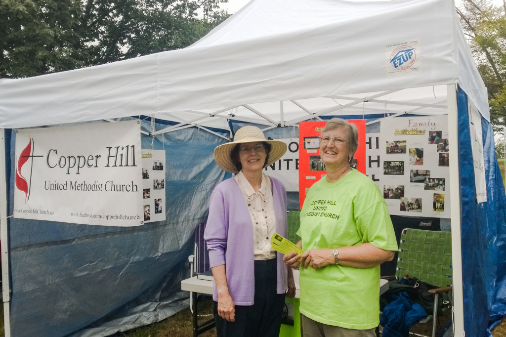 Volunteers judy Holcomb and JoAnne Jones in front of our booth at Suffield on the Green on Sunday
