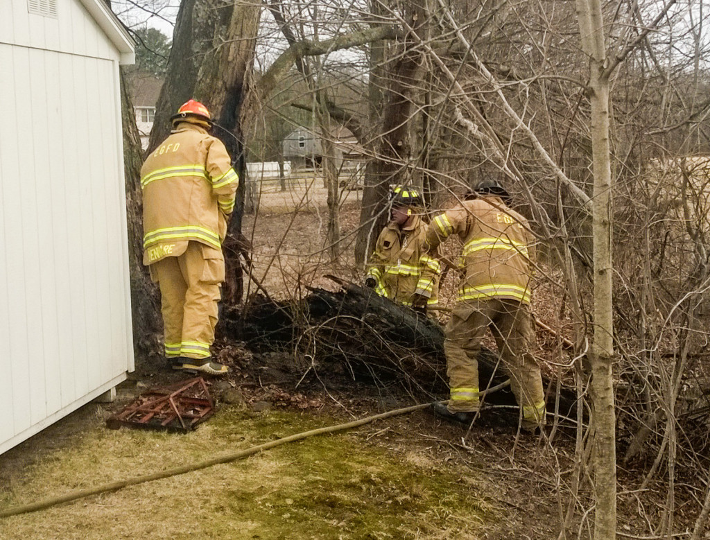 East Granby firemen extinguish brush fire