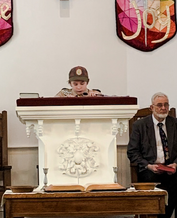 Boy Scout reader at Copper Hill church