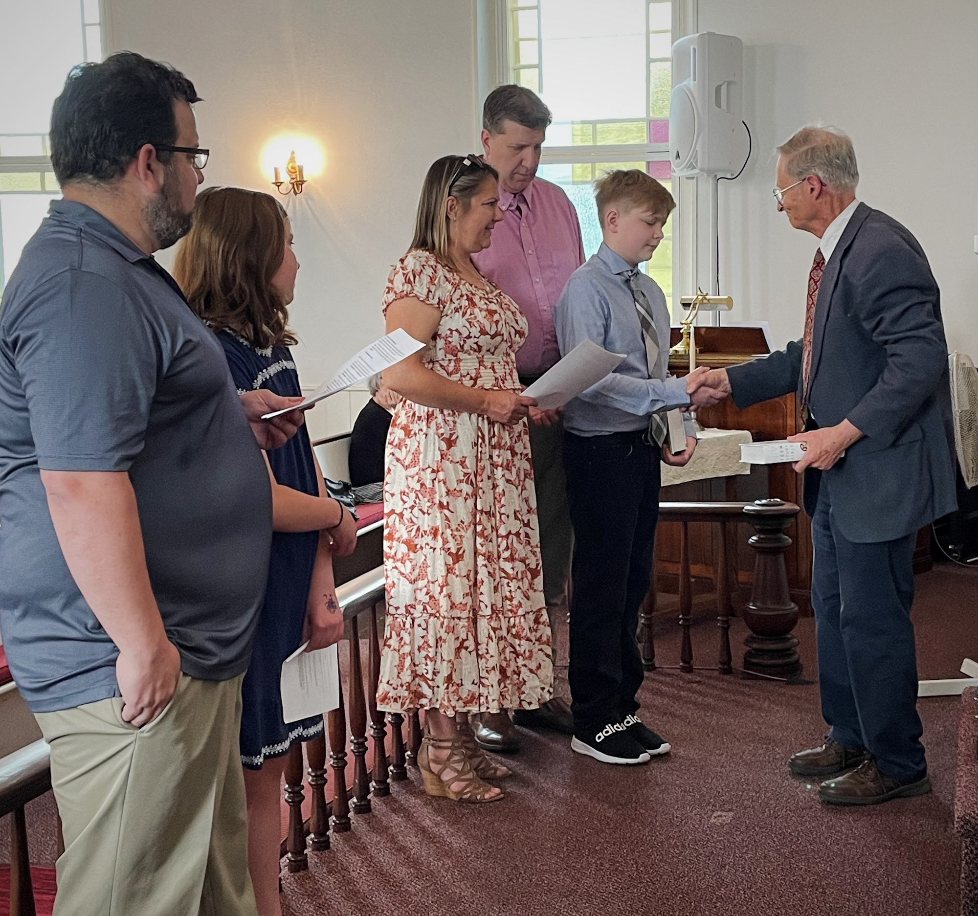 Robert L. presents Bible to Ian