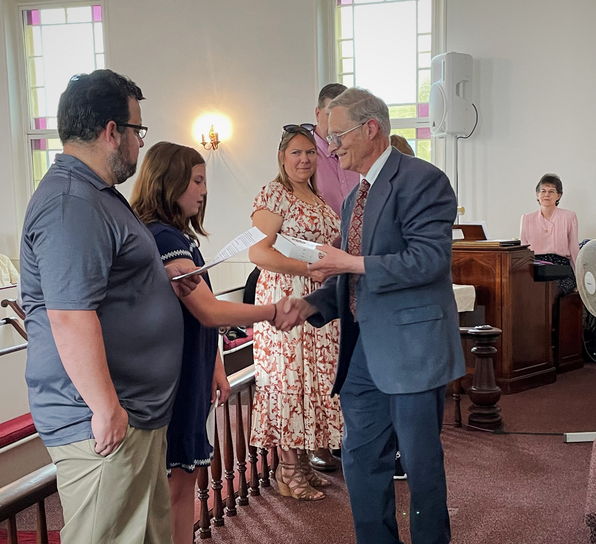 Robert L. presents Bible to Madison