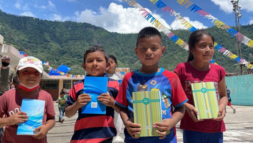 Guatemala children receiving Bibles